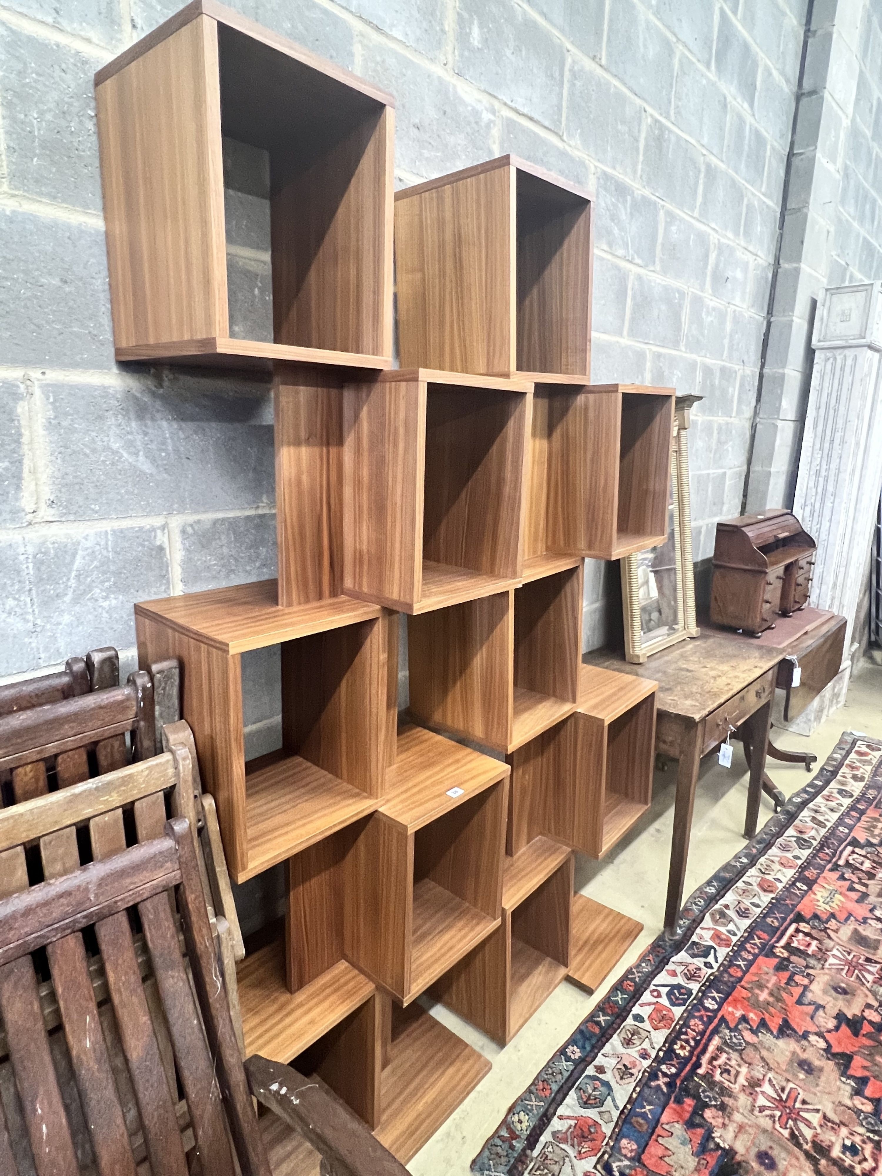 A pair of contemporary walnut open shelf units, width 62cm height 203cm